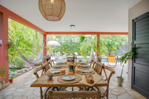a dining room with a table with food on it at Villa Célestine in Saint-Paul
