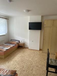 Postel nebo postele na pokoji v ubytování Apartmány J L A