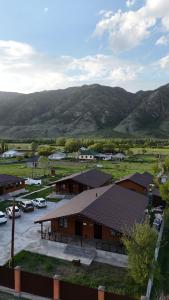 an aerial view of a building with a parking lot at Kolsay Eco House in Saty