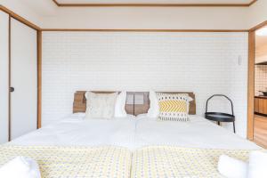 Llit o llits en una habitació de perfect life緑橋