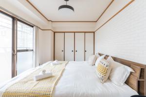 Llit o llits en una habitació de perfect life緑橋