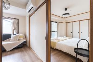 Llit o llits en una habitació de perfect life緑橋