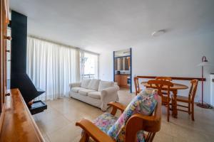a living room with a couch and a table at Torrebaix in Torredembarra