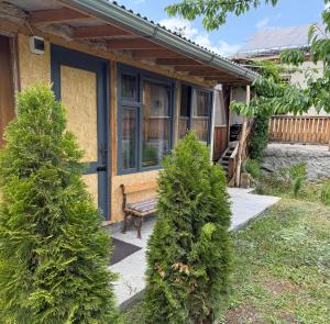 a house with two trees in front of it at Armen's B&B in Sevan