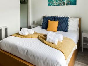 Postel nebo postele na pokoji v ubytování Longford Cottage