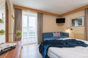 Postel nebo postele na pokoji v ubytování Hotel Nocker