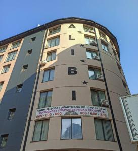 a tall building with stars on the side of it at Alibi S in Zlatibor