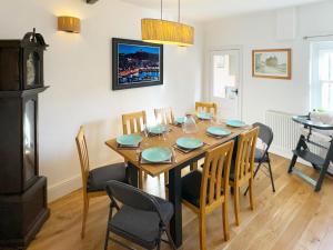 a dining room with a wooden table and chairs at The Anchor in Scarborough