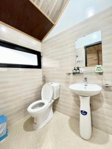 a bathroom with a toilet and a sink at Vạn Tùng Homestay & Café in Xuan An +148 photos