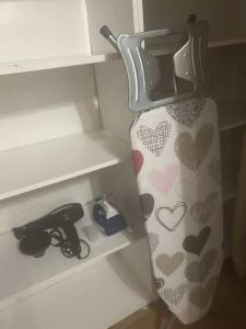 a shelf with a vase and a pair of scissors at Kiki House in Nea Potidaea +9 photos