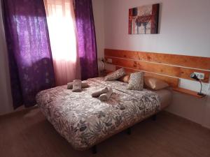 Ένα ή περισσότερα κρεβάτια σε δωμάτιο στο La Olivilla +9 φωτογραφίες