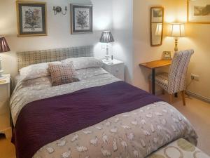 Voodi või voodid majutusasutuse Lilac Cottage toas