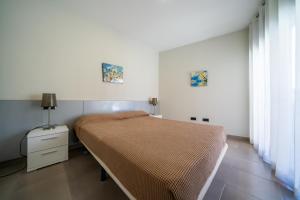 Posteľ alebo postele v izbe v ubytovaní Apartaments Lamoga- Spai