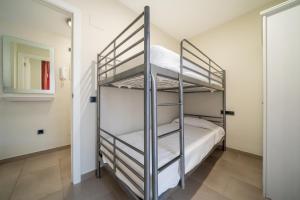 Posteľ alebo postele v izbe v ubytovaní Apartaments Lamoga- Spai
