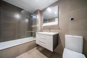 Kúpeľňa v ubytovaní Apartaments Lamoga- Spai + 13 fotografií