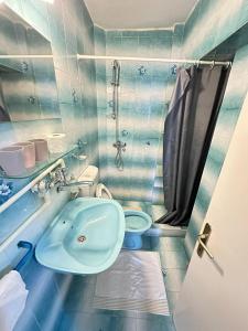 a bathroom with a tub and a toilet and a sink at ROOM 03 Villa KRIVOKAPIC in Budva
