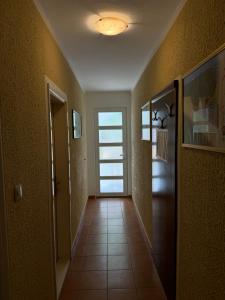 a hallway with a door and a tile floor at ROOM 03 Villa KRIVOKAPIC in Budva