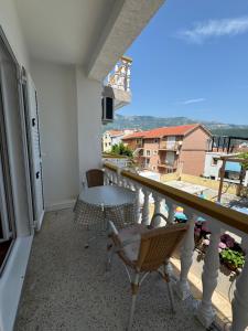 a balcony with a table and chairs and a view at ROOM 03 Villa KRIVOKAPIC in Budva