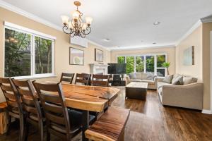 a living room with a table and chairs and a couch at Luxury Retreat in Vancouver in Vancouver