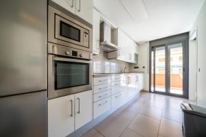Kuchyňa alebo kuchynka v ubytovaní Apartaments Lamoga- Spai
