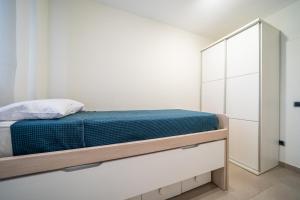 Posteľ alebo postele v izbe v ubytovaní Apartaments Lamoga- Spai