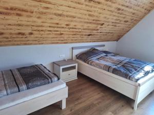 Postel nebo postele na pokoji v ubytování Domček Tadeáš