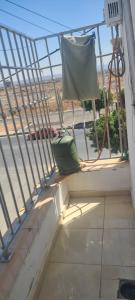 a balcony with a chair sitting on the ledge at دار الضيافة سلوان ليلى in Selouane