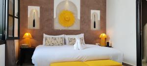 Cama ou camas em um quarto em Riad Come & Va