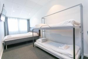 Postel nebo postele na pokoji v ubytování ApartDirect Arlandastad