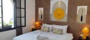 Cama ou camas em um quarto em Riad Come & Va