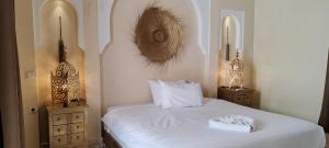 Cama ou camas em um quarto em Riad Come & Va