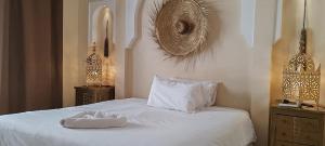 Cama ou camas em um quarto em Riad Come & Va