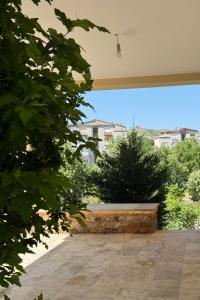 a view of a garden from a patio at Riverside Luxury Apartment in Štip