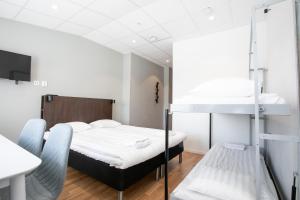 Postel nebo postele na pokoji v ubytování ApartDirect Arlandastad