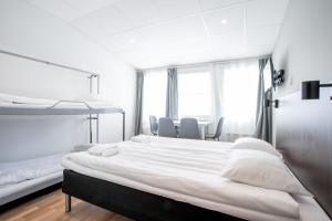 Postel nebo postele na pokoji v ubytování ApartDirect Arlandastad