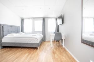 Postel nebo postele na pokoji v ubytování ApartDirect Arlandastad