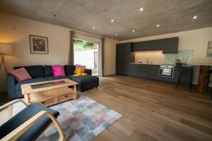 a living room with a couch and a table at Nilsson in Oberaichwald