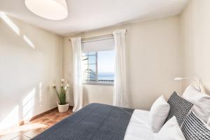 Postel nebo postele na pokoji v ubytování Casa Onelia, 2 bedroom modern oasis, good location