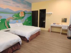 מיטה או מיטות בחדר ב-Xinyuanbao Shangshi Homestay