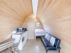 a small room with a couch in a tiny house at Pod Two - Uk44403 in Ross on Wye