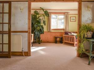 a living room with a couch and a window at Sea Cottage in Turnchapel