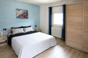 Postel nebo postele na pokoji v ubytování Casa Virginia in Val di Fiemme + 25 fotografií