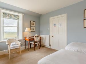 Ένα ή περισσότερα κρεβάτια σε δωμάτιο στο 3 Bed in John O Groats CA337