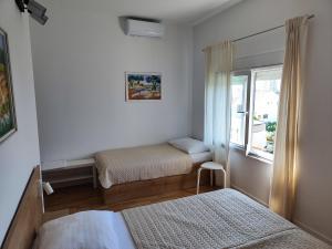 Кровать или кровати в номере Apartmani Seka