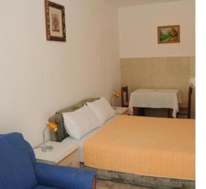 Postel nebo postele na pokoji v ubytování Apartments Dragišić