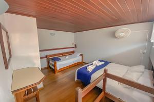 En eller flere senge i et værelse på Flat Ancora 202-A Vista maravilhosa do mar + 33 billeder