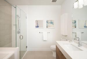 a bathroom with a toilet and a sink and a shower at 2 Bed 2 Bath Stylish Luxury Premium High-Rise Apartment in Los Angeles