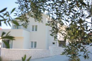 a white building with trees in front of it at Villa Mar in Slano