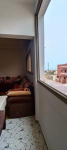 Ένα ή περισσότερα κρεβάτια σε δωμάτιο στο Super appartement familial chez hamza oualidia