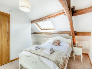 Ένα ή περισσότερα κρεβάτια σε δωμάτιο στο Inglenook Cottage